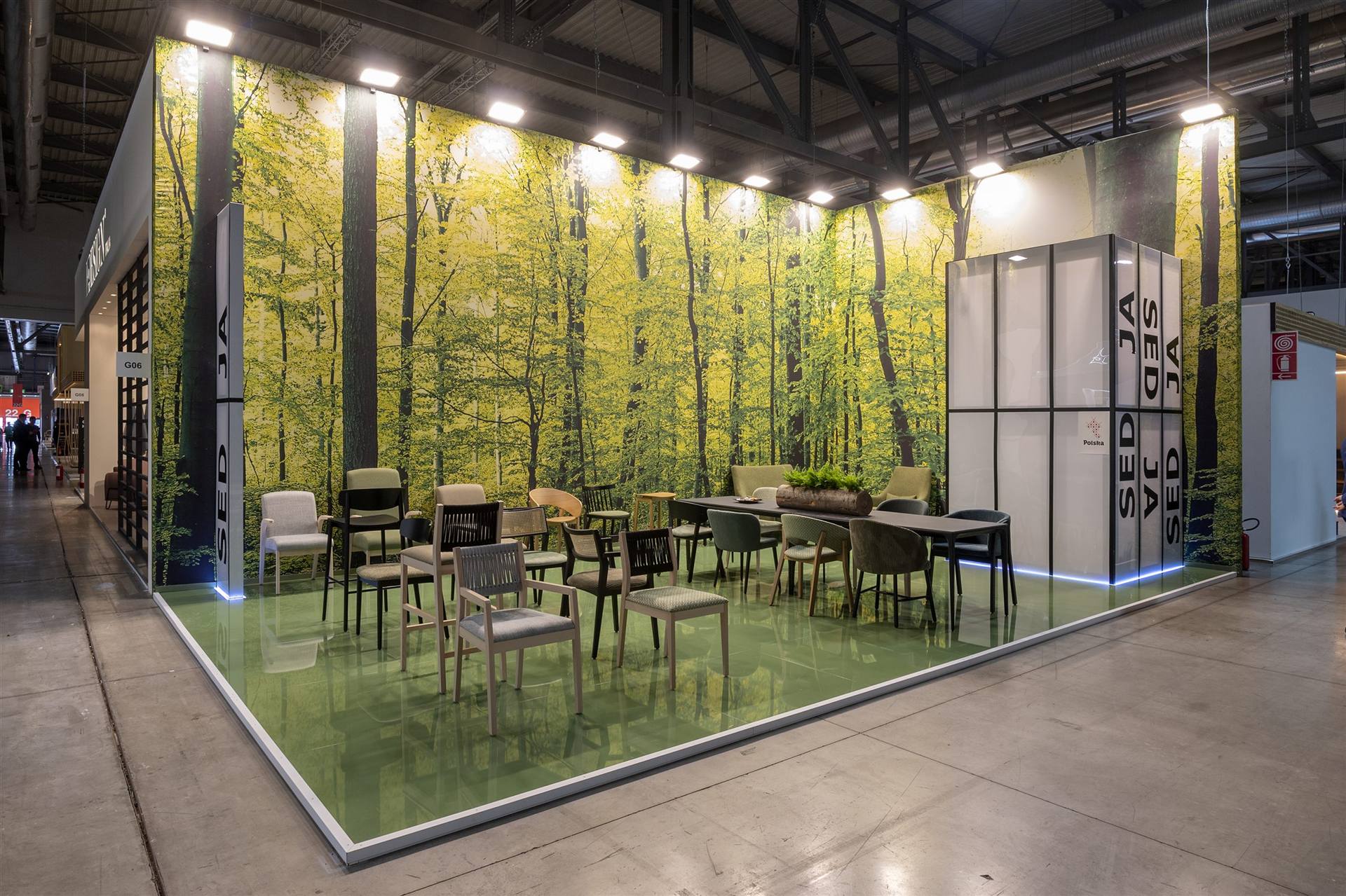 Exhibition stand with a green forest wall